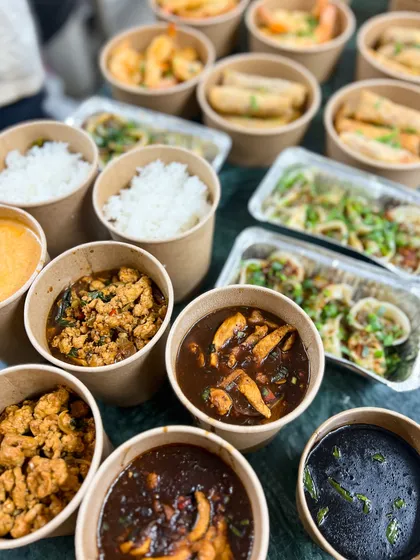A complete Asian meal delivery, showcasing the variety of dishes you can order for your home party. We make hosting easy and delicious.