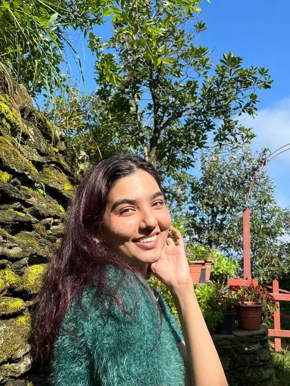 The smile says it all. A happy participant enjoying the beautiful surroundings of our Himalayan retreat.