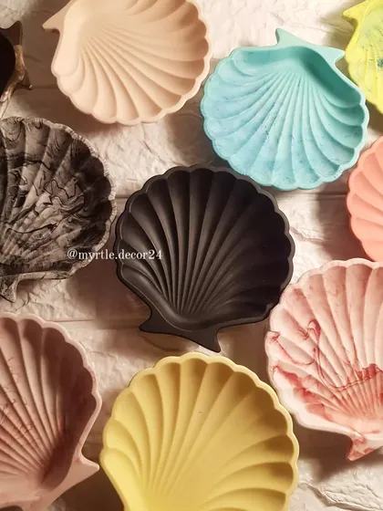 A gathering of our shell dishes, showing the beautiful range of colors and finishes we offer. From soft pastels to bold solids and unique marble effects, we can create a piece that feels just right for your space.