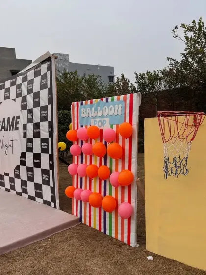 More fun from the game night event. I set up a balloon pop wall and a mini basketball hoop to add a carnival-like feel to the pre-wedding festivities.