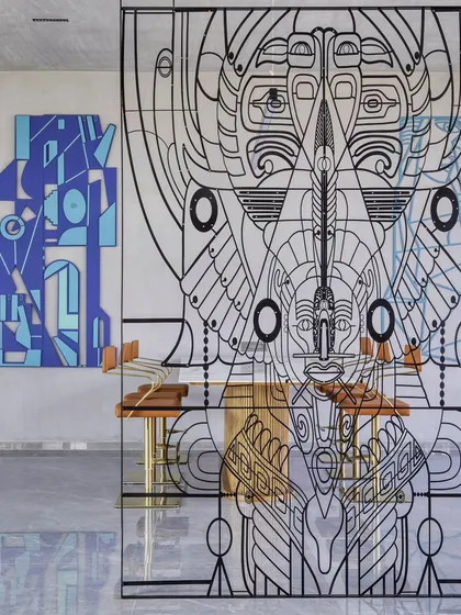Art can be both monumental and minimal. This intricate metal line-art installation serves as a transparent partition, creating a visual story without blocking light or space. We designed this piece to open ancient doors of perception, using modern fabrication techniques to craft a totem-like figure that feels both divine and deeply human.