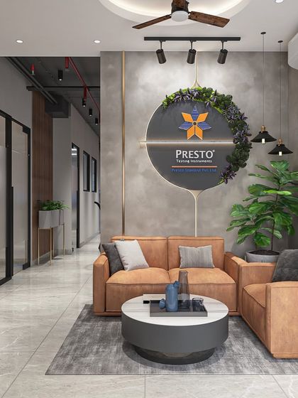 The reception lounge for Presto Testing Instruments uses a mix of concrete textures, warm leather sofas, and greenery to reflect the brand's blend of industrial precision and natural growth.