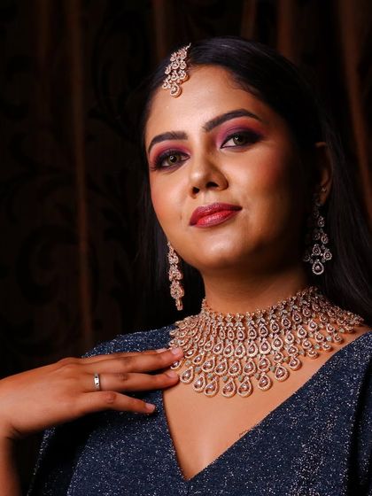 Another stunning shot from the photoshoot. The matching earrings and maang tikka complete the glamorous evening look.