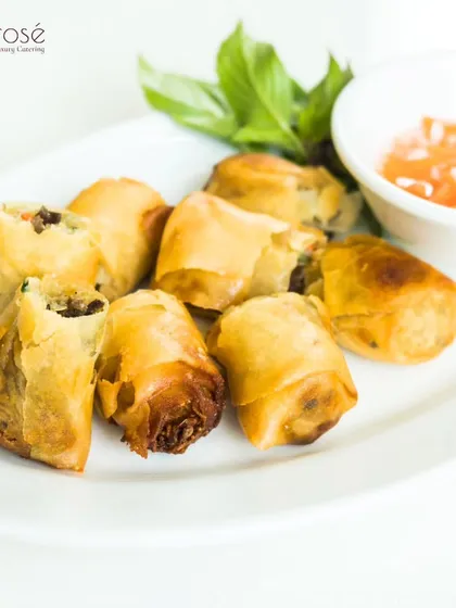 Crispy, golden spring rolls served with a sweet chili dipping sauce. This classic appetizer is executed with perfection, ensuring a satisfying crunch and flavorful filling in every bite.