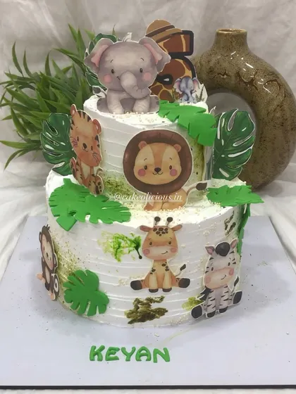 I specialize in creating detailed, non-fondant character cakes. For this jungle-themed birthday, the client wanted edible cutouts instead of full fondant figures. The result was this vibrant, two-tiered chocolate mousse cake decorated with adorable, edible safari animal prints that looked absolutely magical.