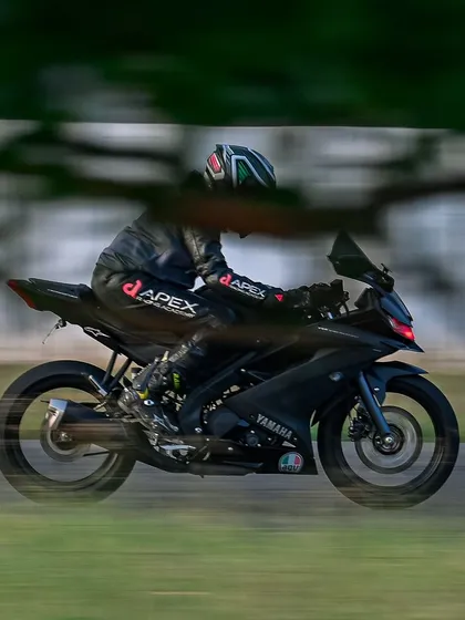 Slay in your lane. A rider on a Yamaha R15 demonstrates smooth riding during a track day at Kari Motor Speedway, showing speed and control.