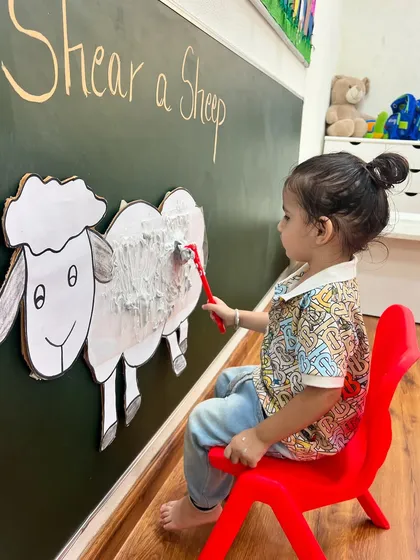 It's shearing season on the farm. During our Farm Animals week, this little farmer is helping "shear" a sheep, a fun activity that develops motor skills and teaches about animals.