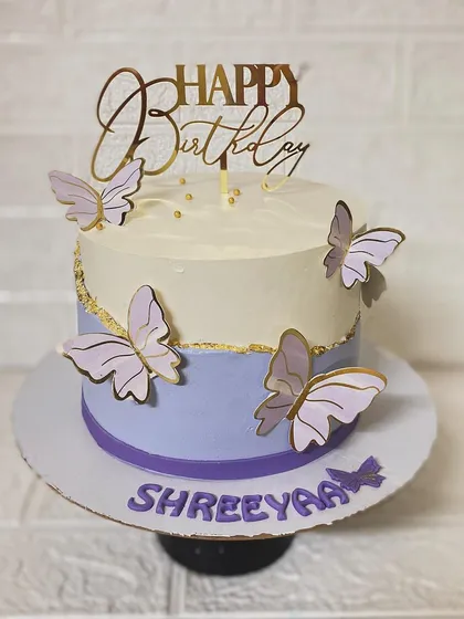 A closer look at the details of the lavender butterfly cake.