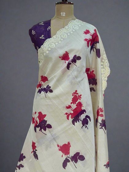 A lovely version of the Kota checks saree with red and purple floral prints.