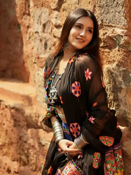 A beautiful, sun-lit shot in a traditional Gujarati lehenga, with a black embroidered dupatta. The look is inspired by the movie Ram-Leela.