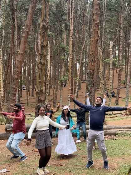 A group having fun and dancing in the Kodaikanal pine forest.