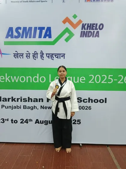 Anushka with her bronze medal for Poomsae at a Khelo India event. Poomsae requires immense precision and focus.