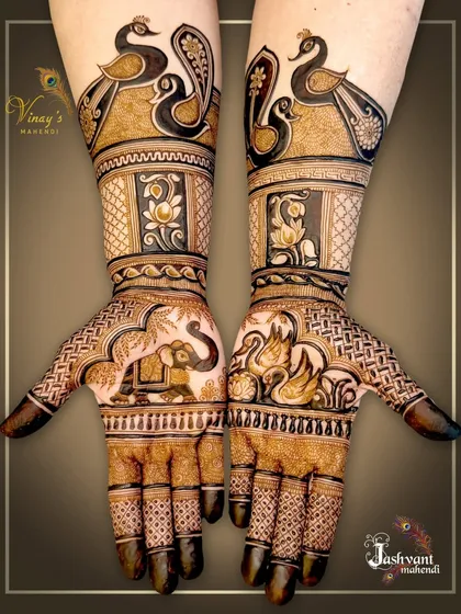 A full view of the asymmetrical design, showing how the elephant, swan, and peacock motifs are balanced across both hands.