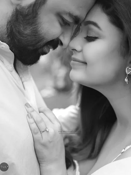 Another intimate black and white moment, focusing on the peaceful and tender connection. These close-up shots are perfect for capturing the subtle emotions of an engagement session.