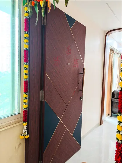 An angled view of the geometric door, showing the subtle gold inlay that outlines the patterns.