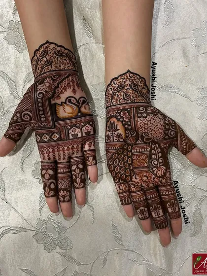 The full view of the design for the groom's sister, showing the asymmetrical patterns on both hands with swans and peacocks.
