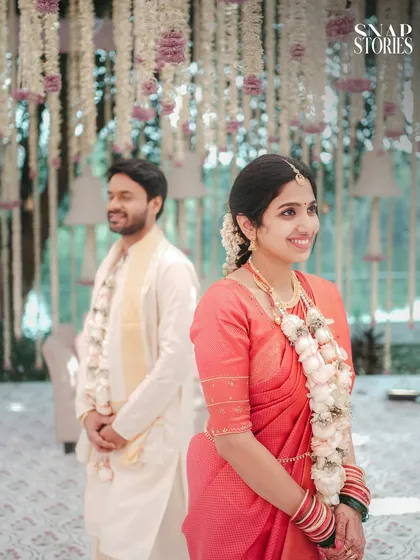 A creative portrait of the bride in the foreground with the groom smiling behind her. We use depth and focus to create artistic and interesting compositions.