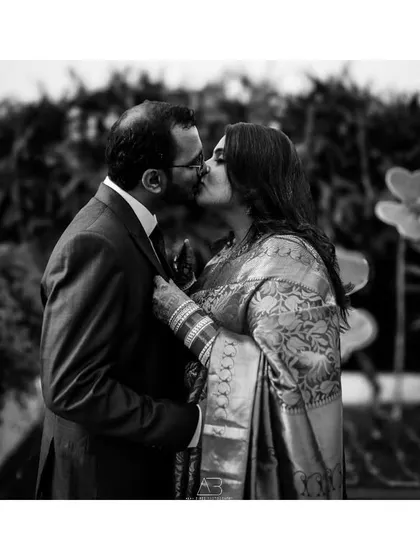 A timeless black and white moment from a post-wedding shoot. Stripping away color lets the pure emotion of the kiss and the connection between the couple become the entire story.