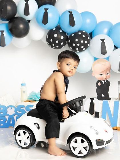 Arriving in style for his first birthday party. This Boss Baby setup, complete with a mini convertible, is perfect for the little man who's already running the show.