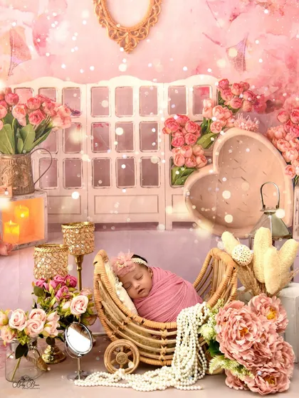 An artistic edit of the vintage pink vanity setup, with added sparkle and soft focus to enhance the dreamy, fairy-tale quality of the newborn portrait.