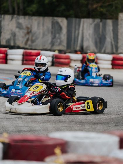 A three-kart battle in the Micro category.