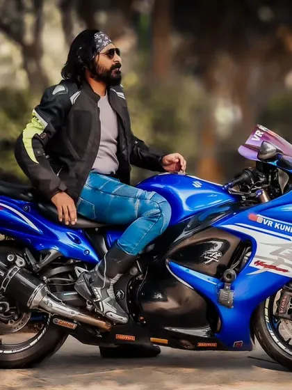 Fashion isn't just about clothes; it's about an attitude. This automotive-themed shoot for a male portfolio captures a powerful, rugged aesthetic, pairing the rider's style with the sleek design of a Suzuki Hayabusa superbike.