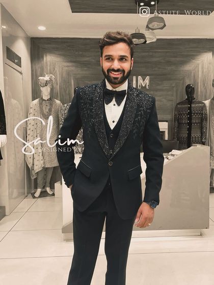 A happy client in a three-piece tuxedo with embellished lapels. The smile says it all; my greatest satisfaction is seeing a client feel confident in my creation.