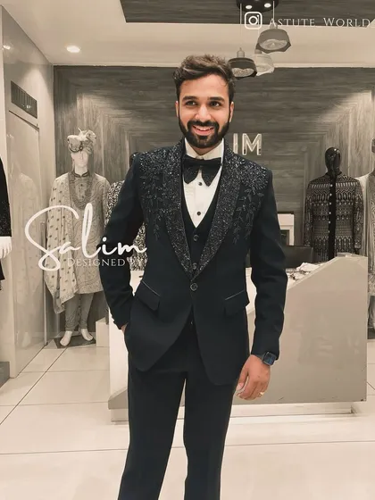 A happy client in a three-piece tuxedo with embellished lapels. The smile says it all; my greatest satisfaction is seeing a client feel confident in my creation.