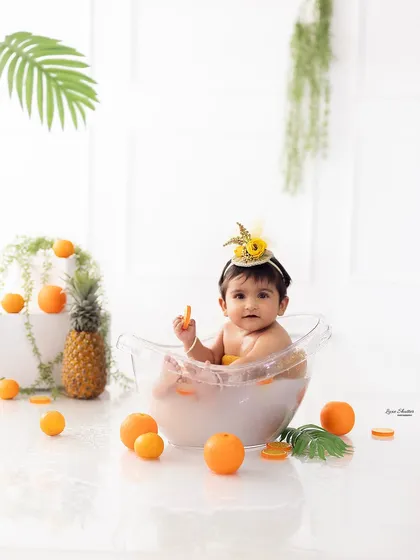 A full view of our citrus fruit bath setup, showing the clean, bright, and fun atmosphere we create for these milestone sessions.