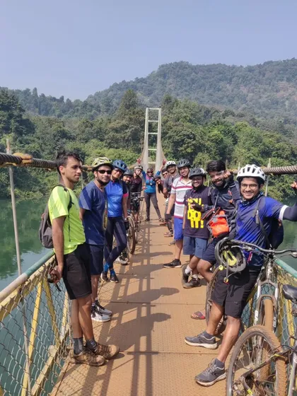 A group of happy riders on a suspension footbridge over the Kali river. This is a highlight of our Dandeli tour, taking you deep into the wild country of the Kali Tiger Reserve.