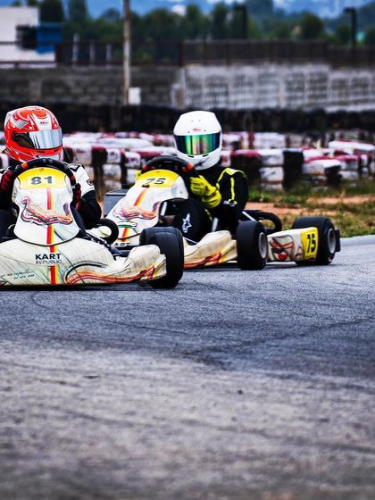 A three-kart battle for position during the Meritus Cup.