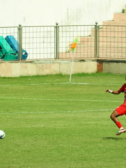A player on the run, driving the ball forward. This is the attacking football we love to play.