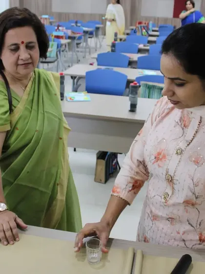 An instructor guides trainees through a practical life exercise. These activities are the foundation of the Montessori environment, and you will learn how to present them in a way that fosters independence, coordination, and concentration in children.