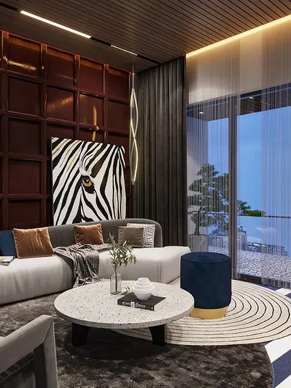 This dark-toned living area exudes confidence with its rich textures and striking zebra-print accents. The deep, moody palette and contemporary furniture make a bold statement.