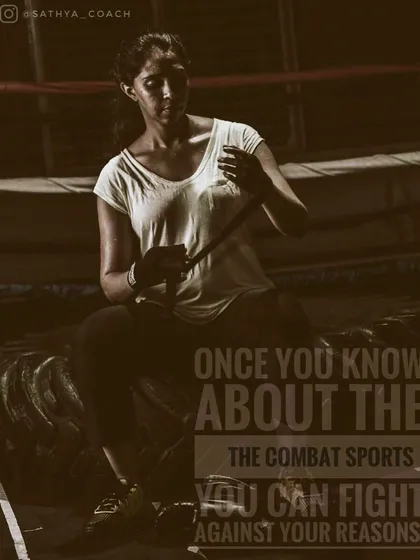 The moments before training are for mental preparation. Here, a student wraps her hands, a crucial ritual for protecting the tools of our craft. It signifies a commitment to the hard work ahead in her combat sports journey.