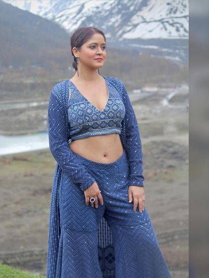 A candid-style shot that shows the outfit in a natural, relaxed pose.