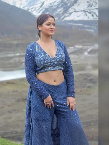 A candid-style shot that shows the outfit in a natural, relaxed pose.