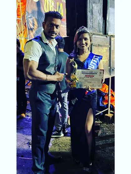 With my coach after the win. Having a great mentor is crucial for success, and I apply the same principle when I coach my own clients.