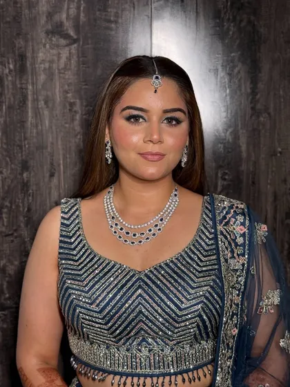 My bride Nain, looking gorgeous for her engagement. She wore a stunning navy blue lehenga, and we created a beautiful smokey eye with silver glitter to match the intricate work on her outfit.