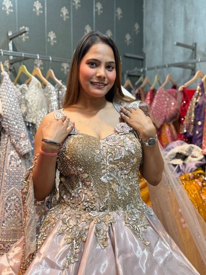 This client is glowing in her choice of a premium rental gown. The fit is perfect, and she's ready for her big event.