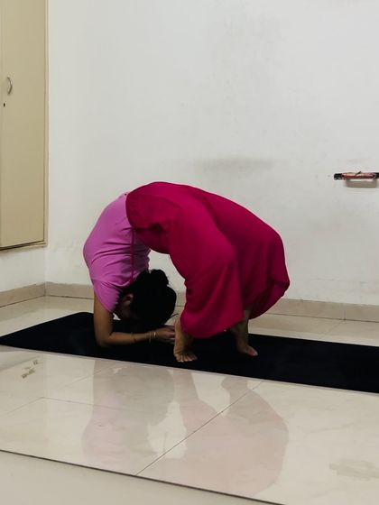 Even on hectic days, I make time for practice. Here, I'm in a deep forearm wheel pose, focusing on opening my spine and shoulders.