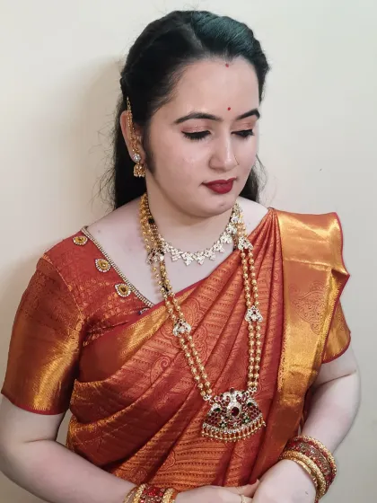 Getting this lovely mom ready for her son's birthday party. We chose a classic look with a red lip that perfectly matched her beautiful silk saree.