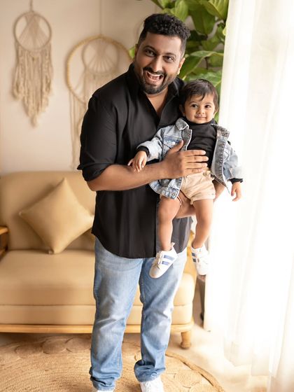 Happiness is treasuring these precious moments. A father and son share a happy moment in our cozy, plant-filled studio.