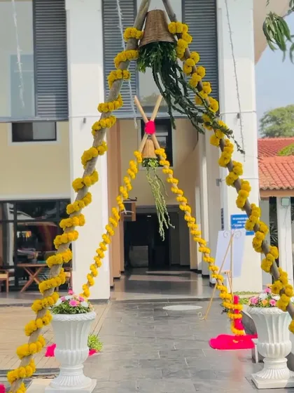 A simple yet beautiful entrance arch made of marigold garlands, a classic element of Indian festive decor.