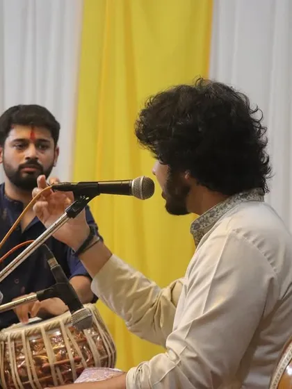 A moment of musical interaction during the performance at Krushnaveni Utsav in Nrusinhawadi.