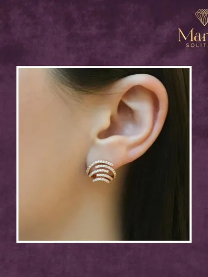 Perfectly crafted for the modern woman, these swirling diamond studs offer everyday luxury. They are comfortable, elegant, and add a subtle sparkle to your ear.