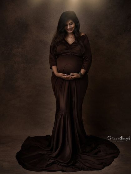Earthy and elegant. This rich, chocolate-brown gown drapes beautifully for a simple yet stunning portrait that radiates warmth and serenity.