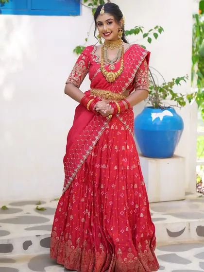 A full view of a vibrant red lehenga drape, perfect for sangeets or receptions. I can create various creative drapes that blend traditional elegance with a modern flair.