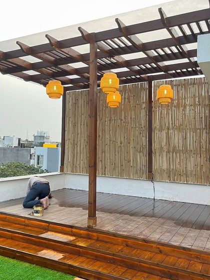 The final touches are crucial. Here, a member of my team is applying a protective oil coating to the Thermopine wood deck, ensuring its longevity and enhancing the natural grain.