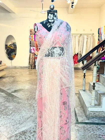 Another angle of the 'CHAMKEELI' saree, showcasing its beautiful drape and the matching embellished blouse.
